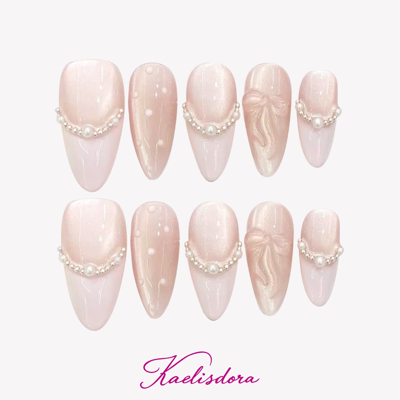 Pearl Bow almond press-on nails featuring soft pink gradient, 3D bow details, pearl embellishments, and luxury handmade nail art