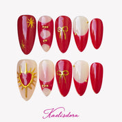 Red Eros vintage French almond press-on nails with red and nude colors gold bows and luxury details