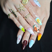 Elegant almond press on nails with handmade floral nail art for vacation and party looks