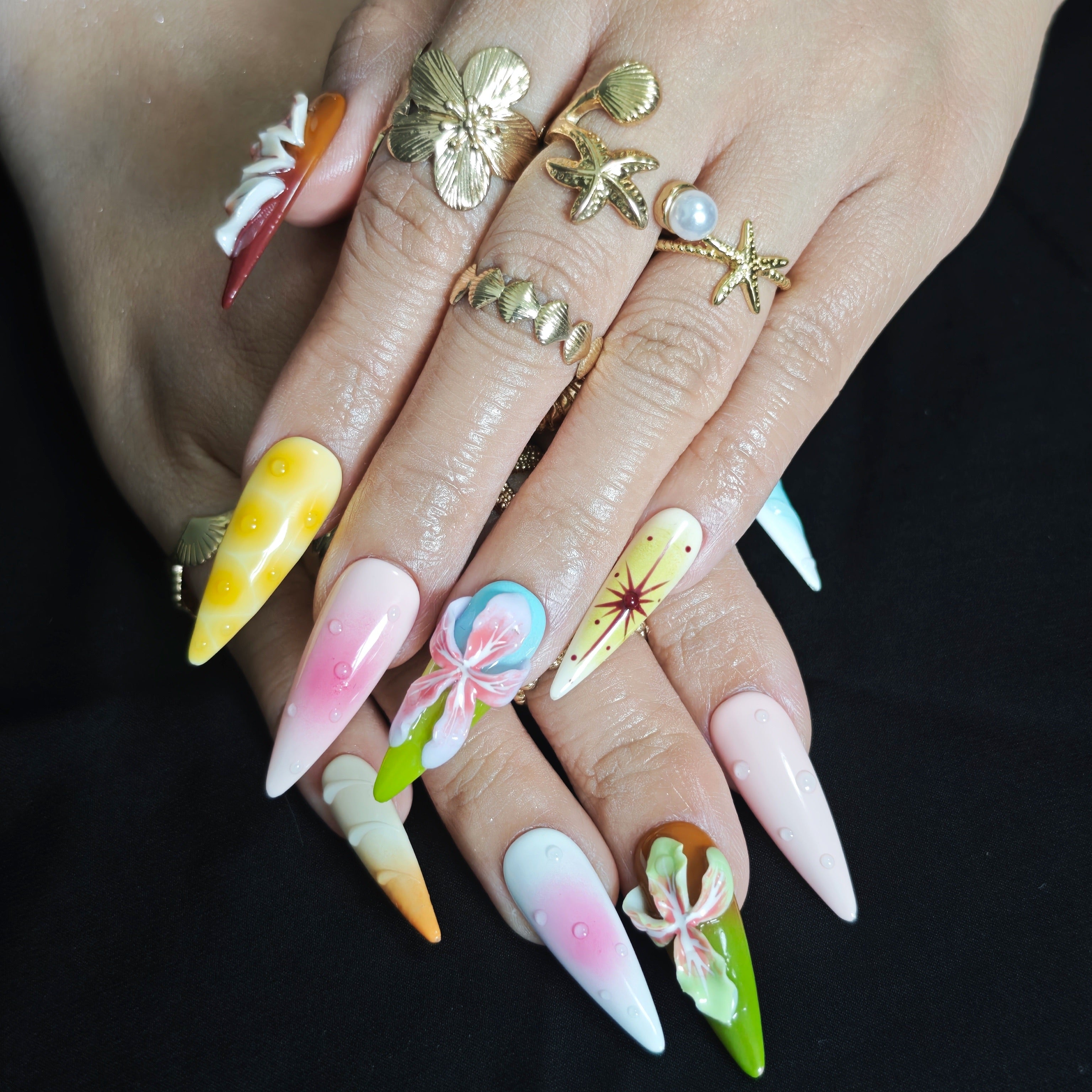 Close up of handcrafted 3D flowers on luxury gel press on nails