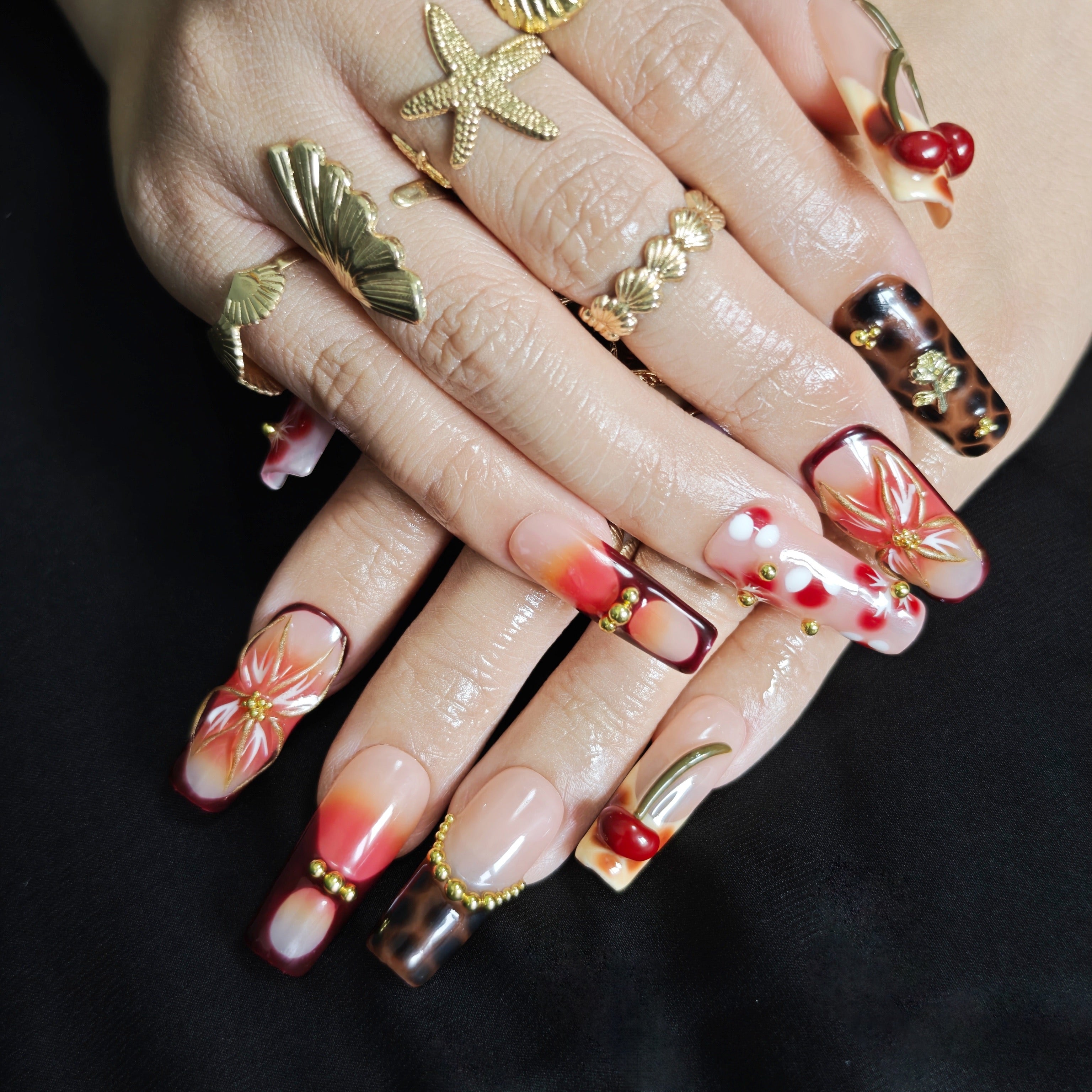 Caramel leopard print coffin press on nails with floral artwork and gold accents