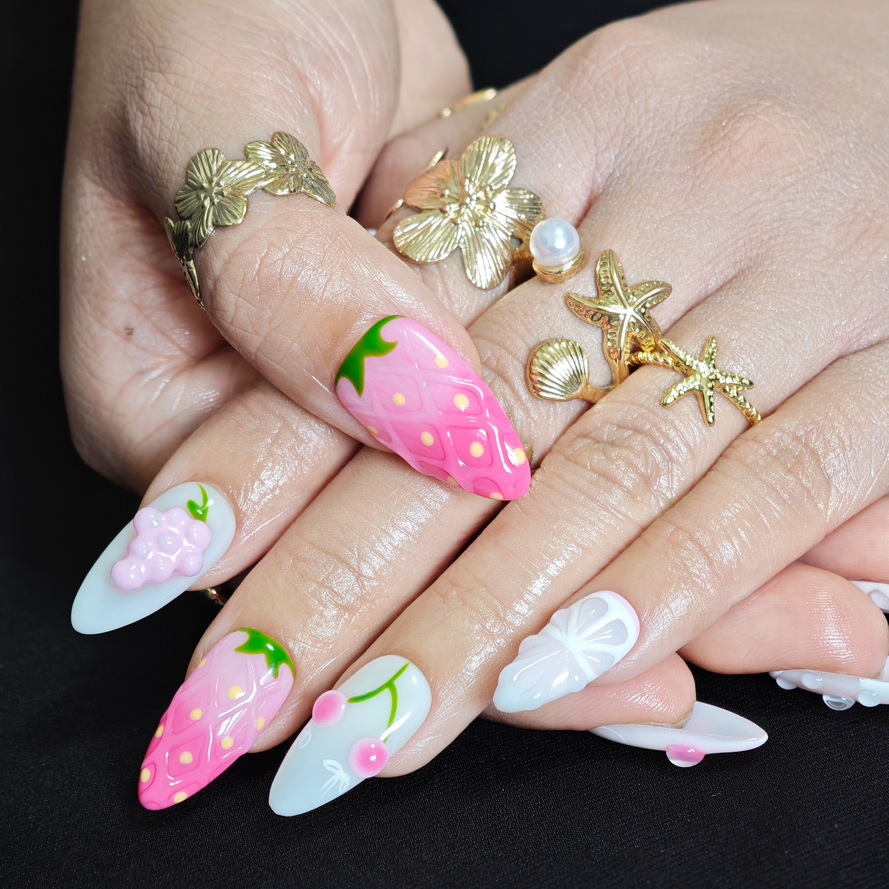 Close up of realistic 3D strawberry details on luxury handmade press on nails