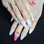 Pink and white almond press on nails with handcrafted cherry orange and strawberry nail art