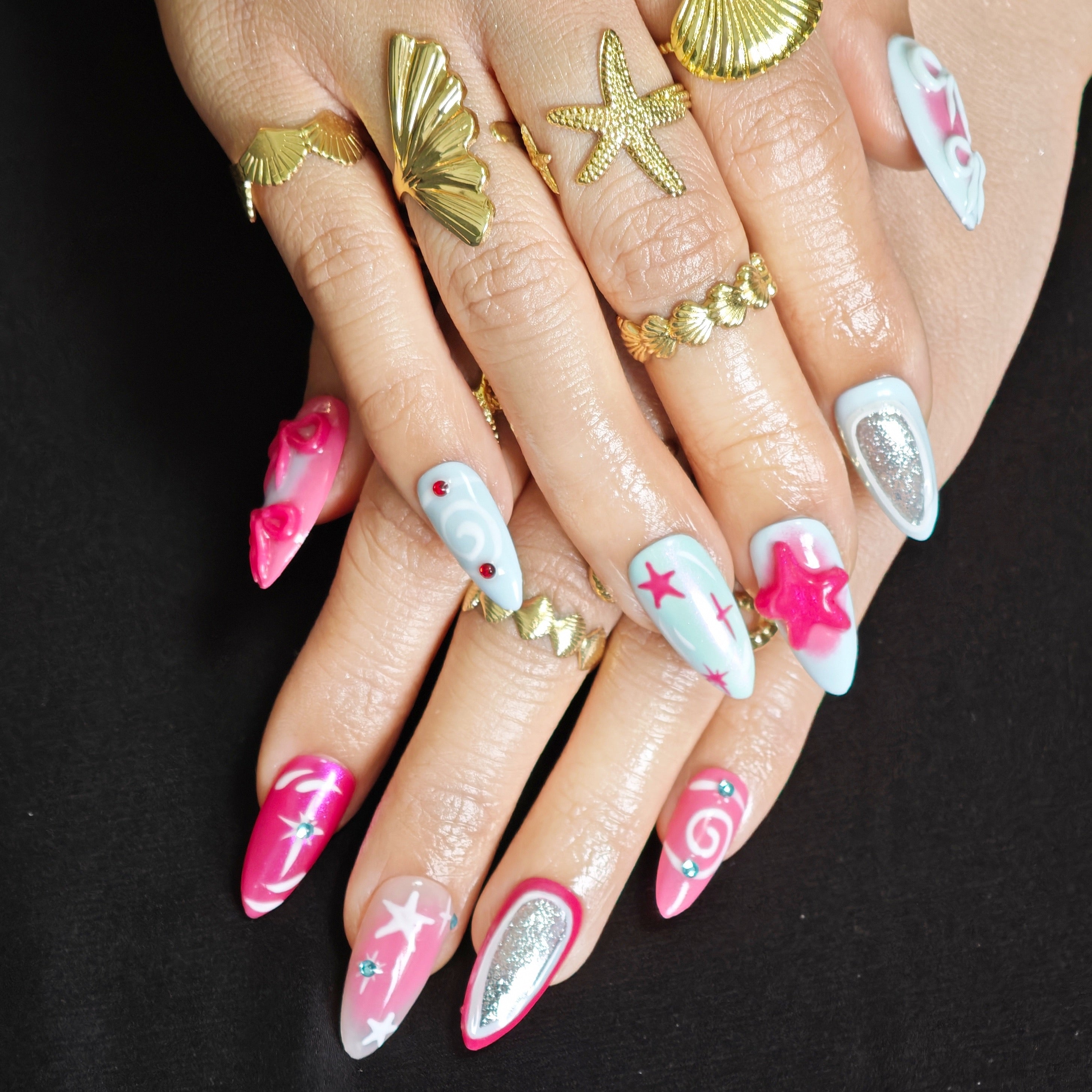 Pink and blue press on nails with star details and sparkling crystal accents