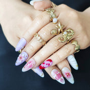Mauve floral press on nails with gold bead accents and handmade nail art details