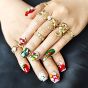 Cute short square Christmas press-on nails with colorful 3D gingerbread, Christmas tree, apple, and bear designs, office-friendly style