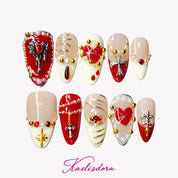 Pearl Ruby gothic almond press-on nails with ruby red French tips gold chains and pearl details