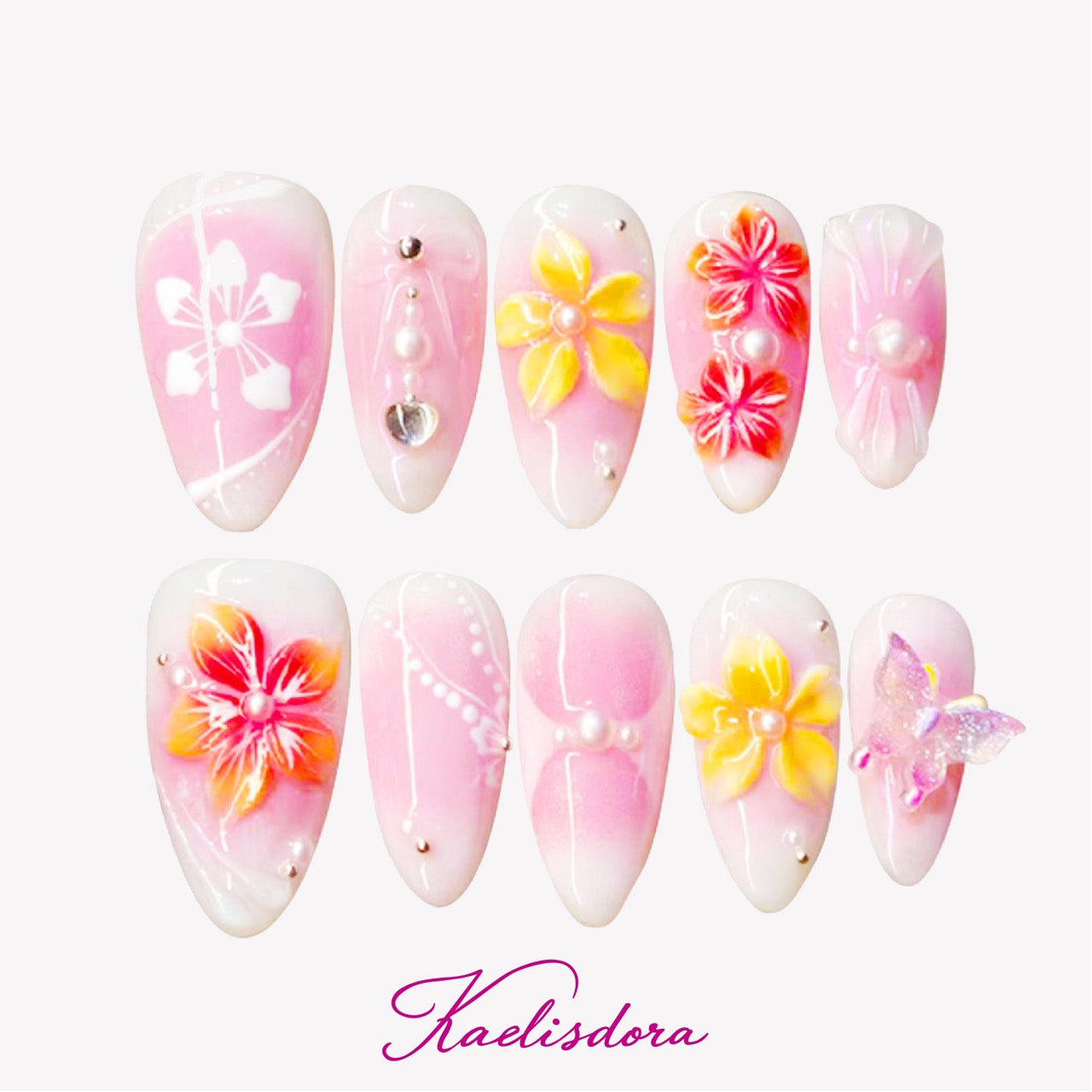 Soft pink and yellow almond press-on nails with delicate 3D floral designs and butterfly accents, elegant and feminine style.
