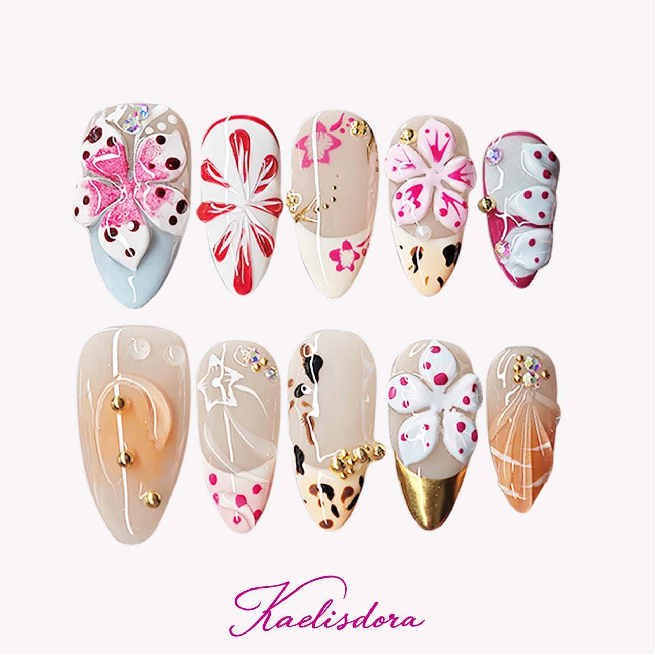 Flora Island 3D orange almond press-on nails featuring tropical inspired design with handmade floral details, colorful accents, and luxury nail art