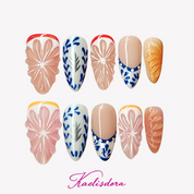 Orange Zest 3D orange almond press-on nails featuring Mediterranean blue and white ceramic-inspired design with handmade luxury nail art