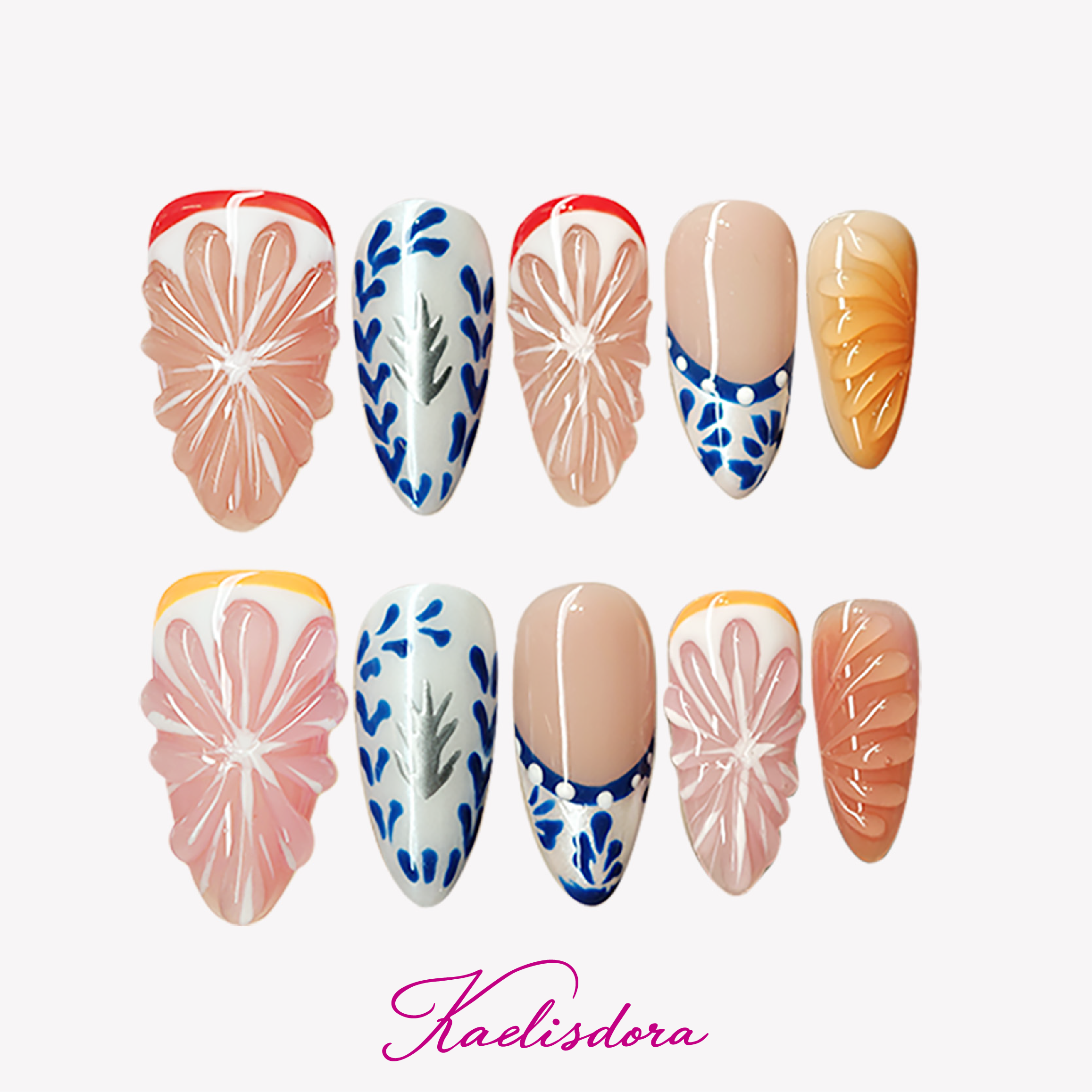 Orange Zest 3D orange almond press-on nails featuring Mediterranean blue and white ceramic-inspired design with handmade luxury nail art