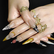Bold luxury stiletto press on nails with gold statement design for fashion looks