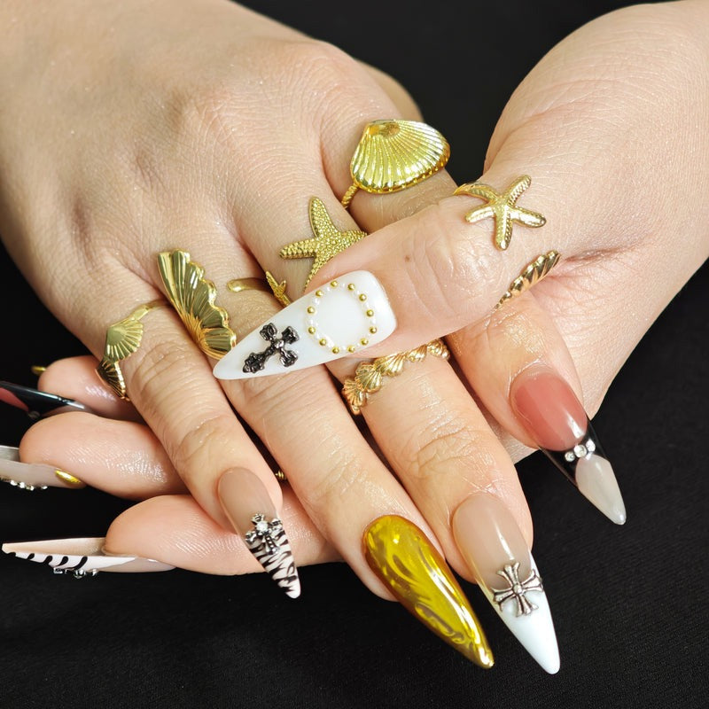 Black and white zebra pattern stiletto press on nails with gold artistic details